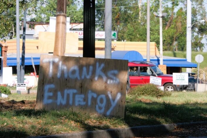 Plywood sign that says 'Thanks Entergy' spotted in September 2005 in New Orleans, Louisiana, after Hurricane Katrina made landfall.